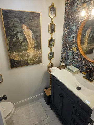 a bathroom with a double vanity sink and mirror