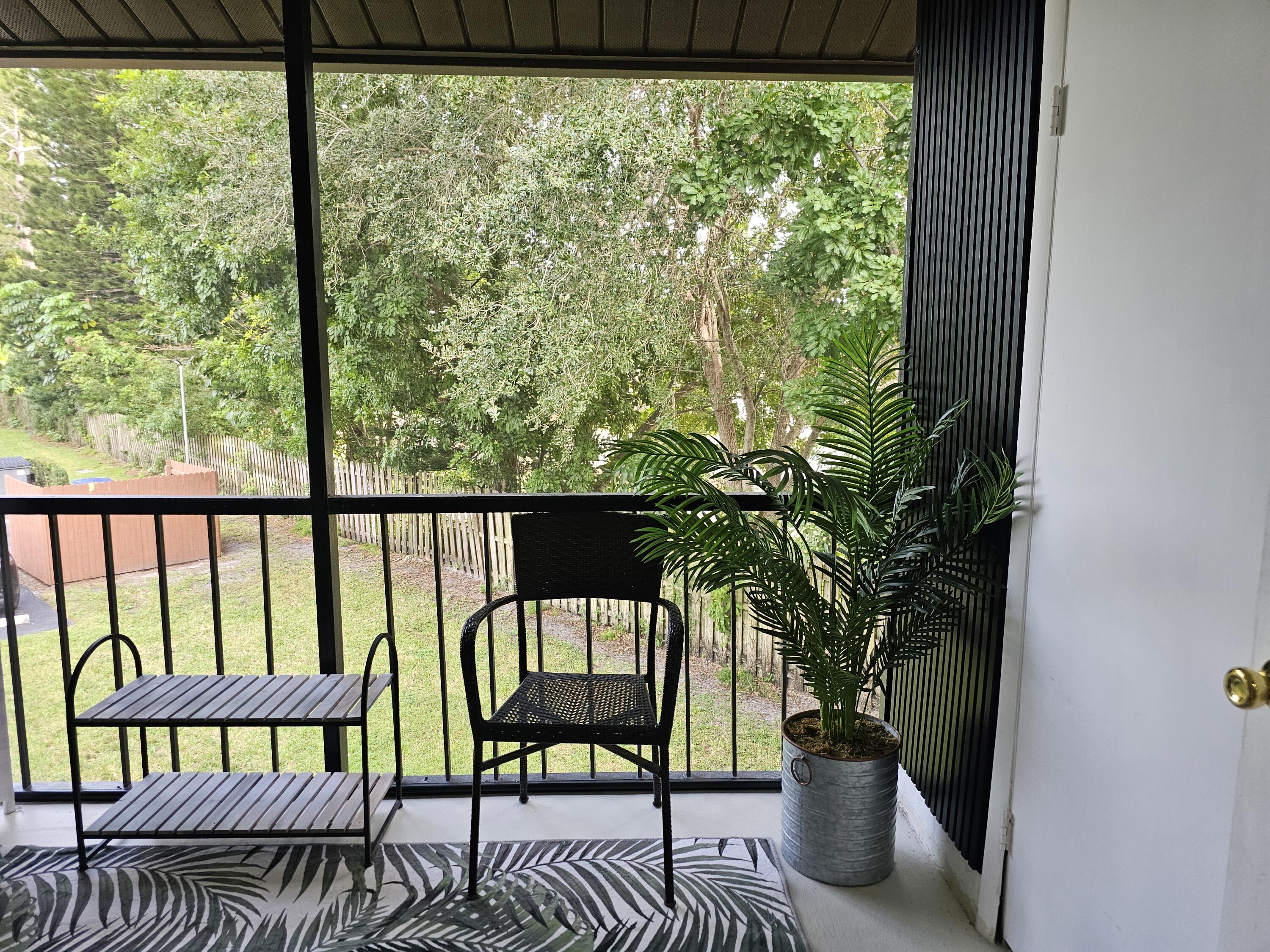 312 Pine Ridge Circle, Unit A2 Greenacres, FL 33463 - Photo 42 of 73 a view of a porch with furniture and floor