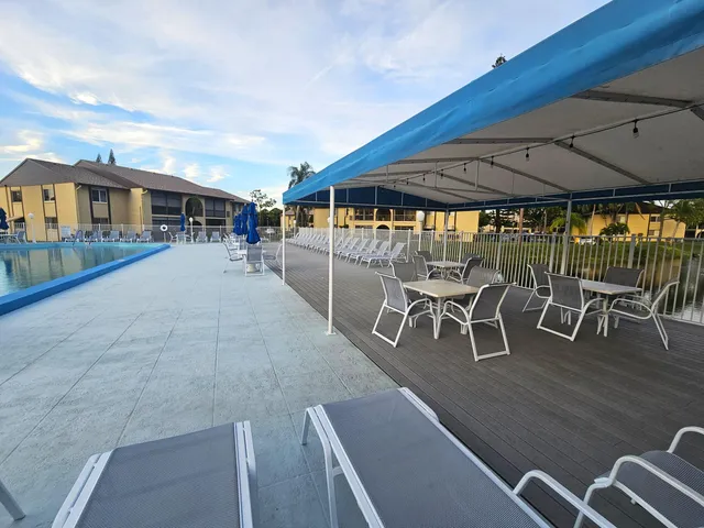 a kitchen with stainless steel appliances a refrigerator and a stove top oven