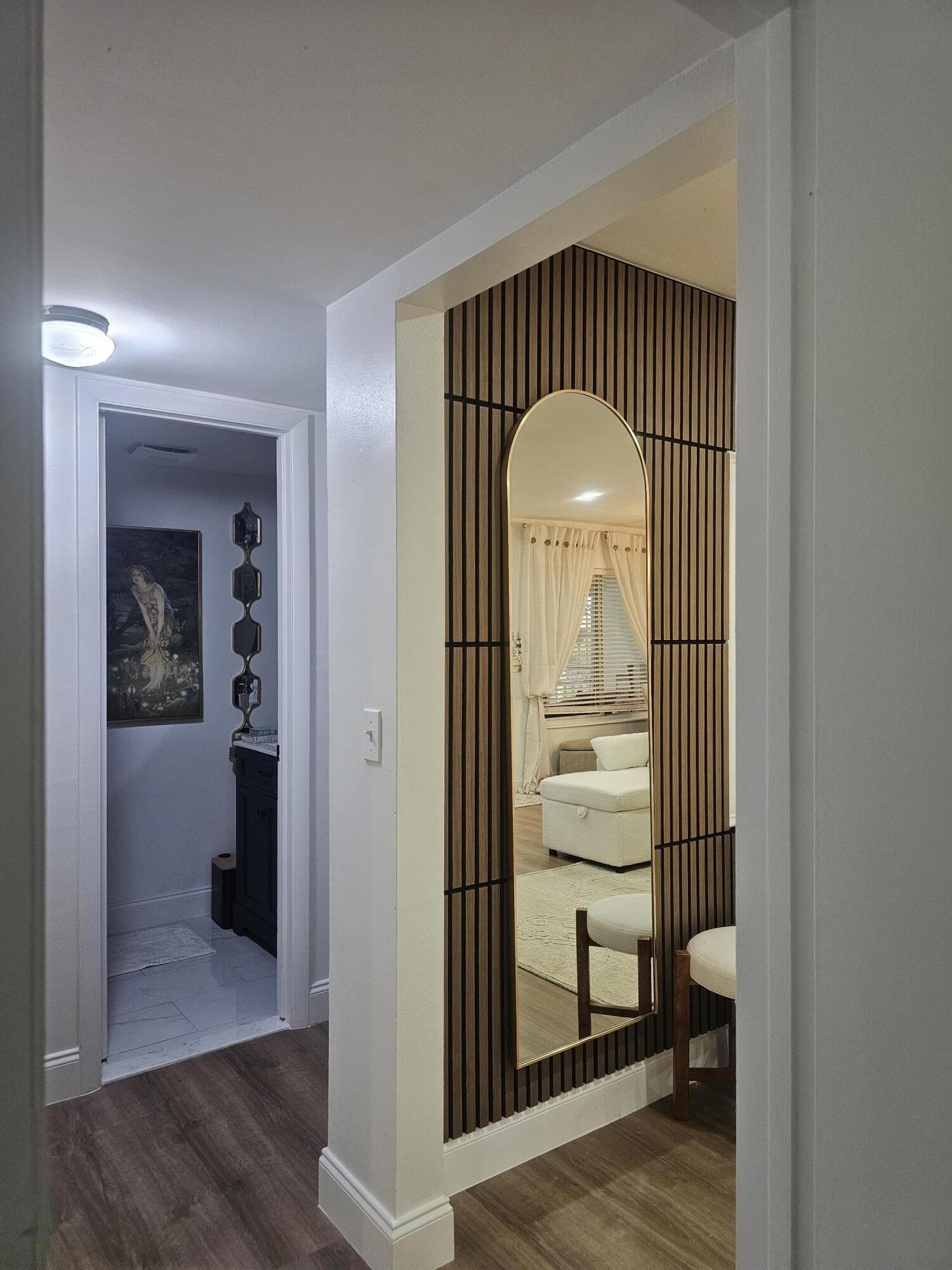 312 Pine Ridge Circle, Unit A2 Greenacres, FL 33463 - Photo 59 of 73 a view of a hallway view with wooden floor and staircase