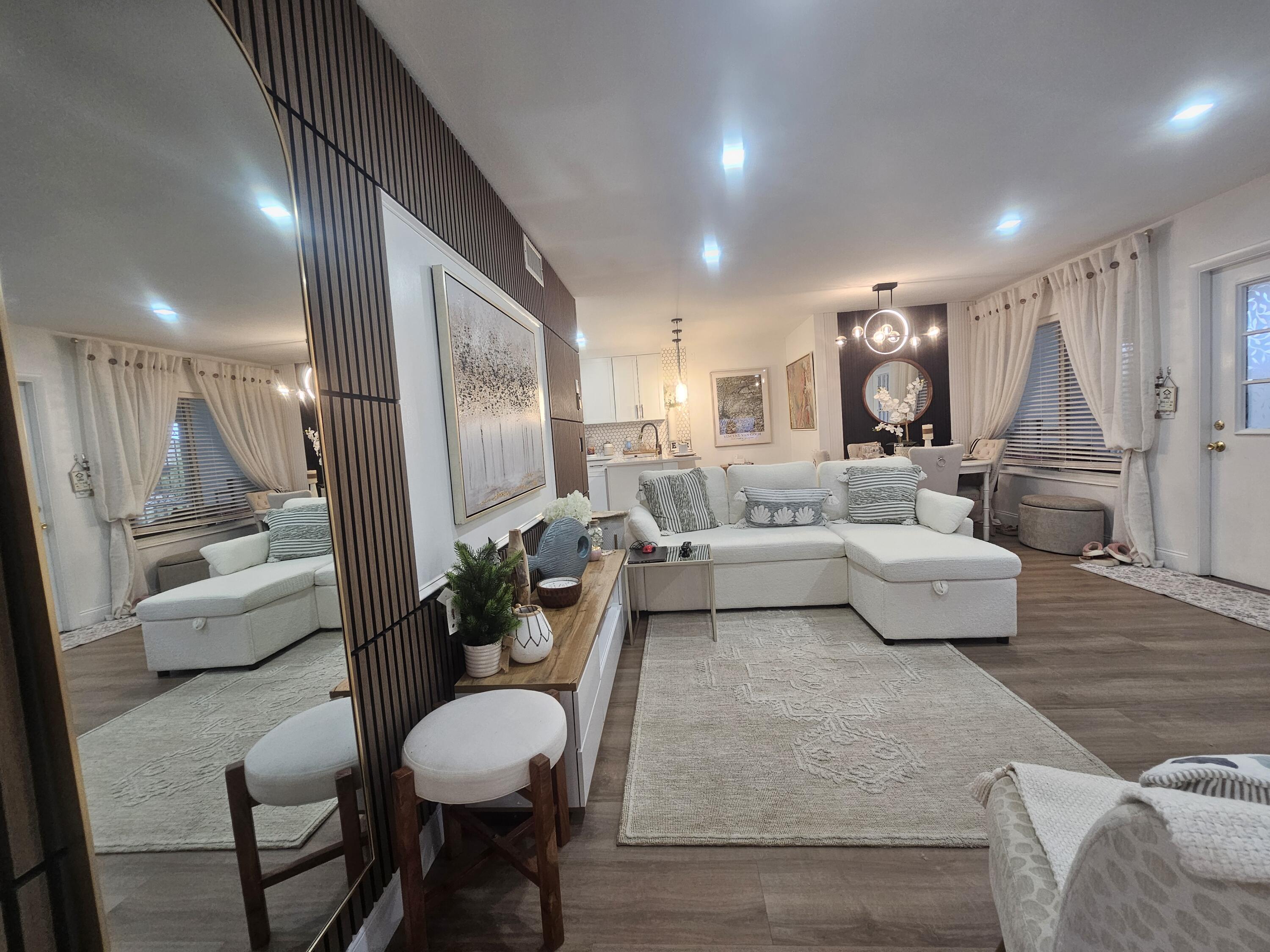 312 Pine Ridge Circle, Unit A2 Greenacres, FL 33463 - Photo 6 of 73 a living room with furniture and a wooden floor