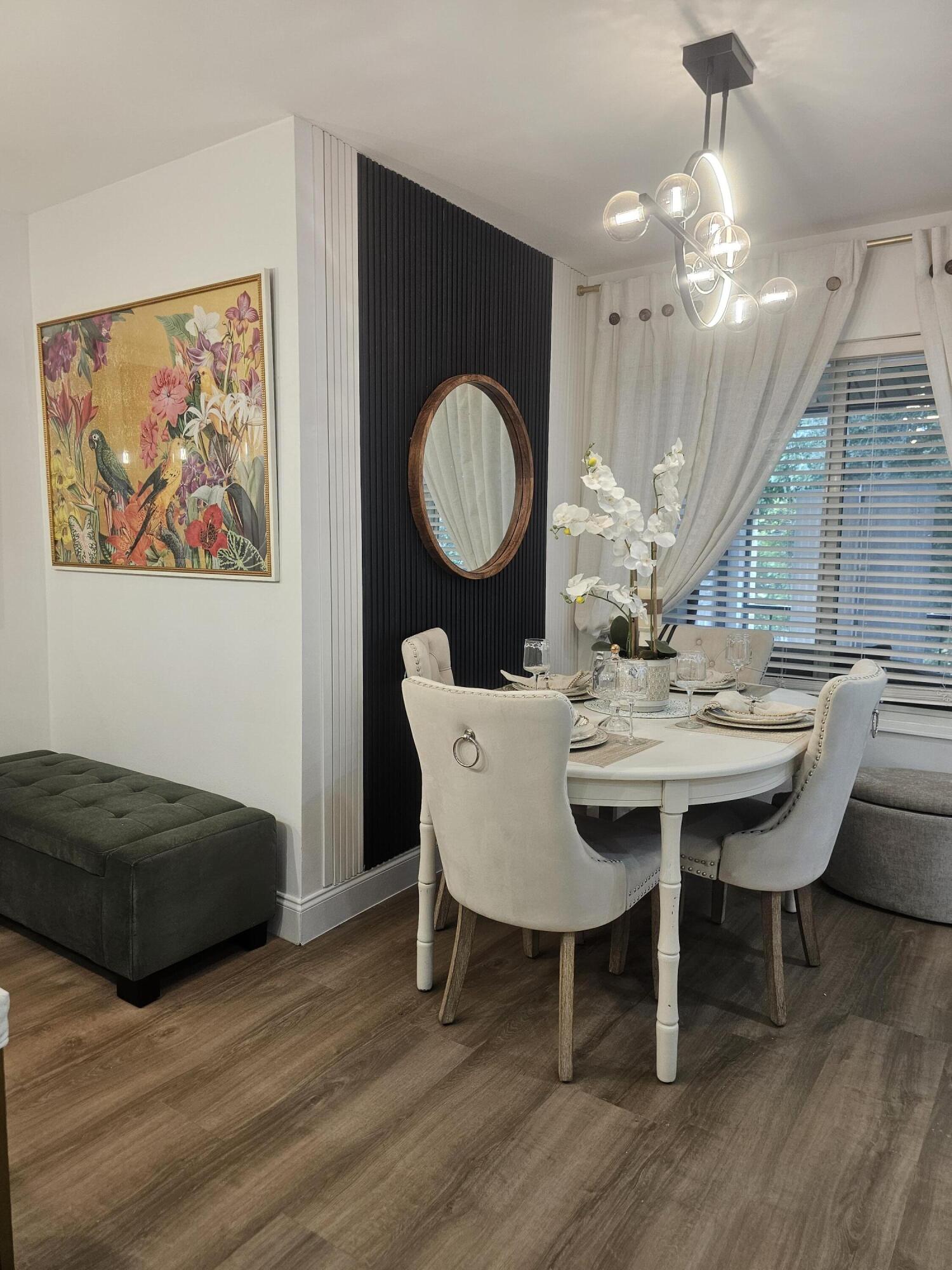 312 Pine Ridge Circle, Unit A2 Greenacres, FL 33463 - Photo 66 of 73 a view of a dining room with furniture and wooden floor