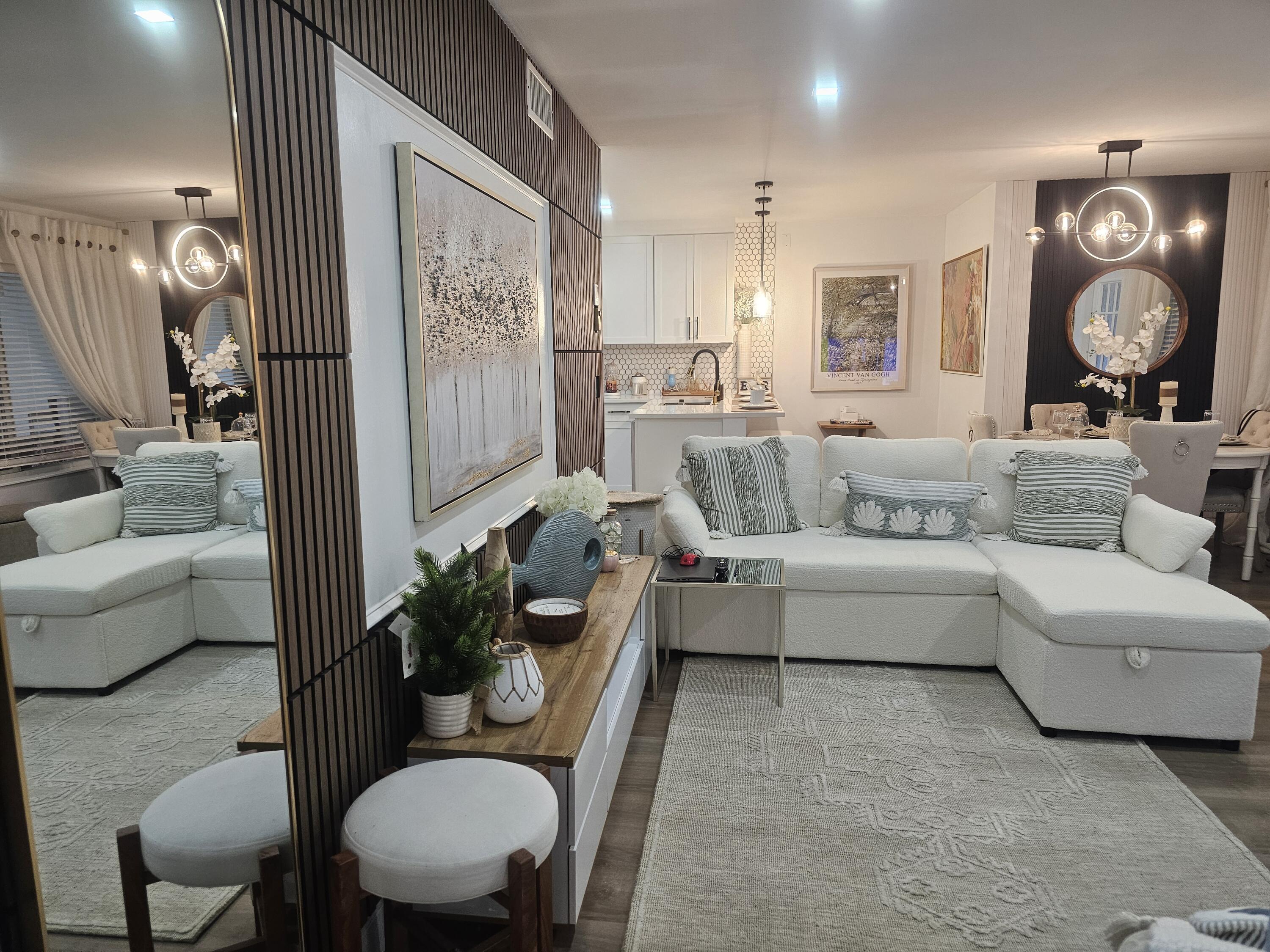 312 Pine Ridge Circle, Unit A2 Greenacres, FL 33463 - Photo 70 of 73 a living room with furniture and a large window