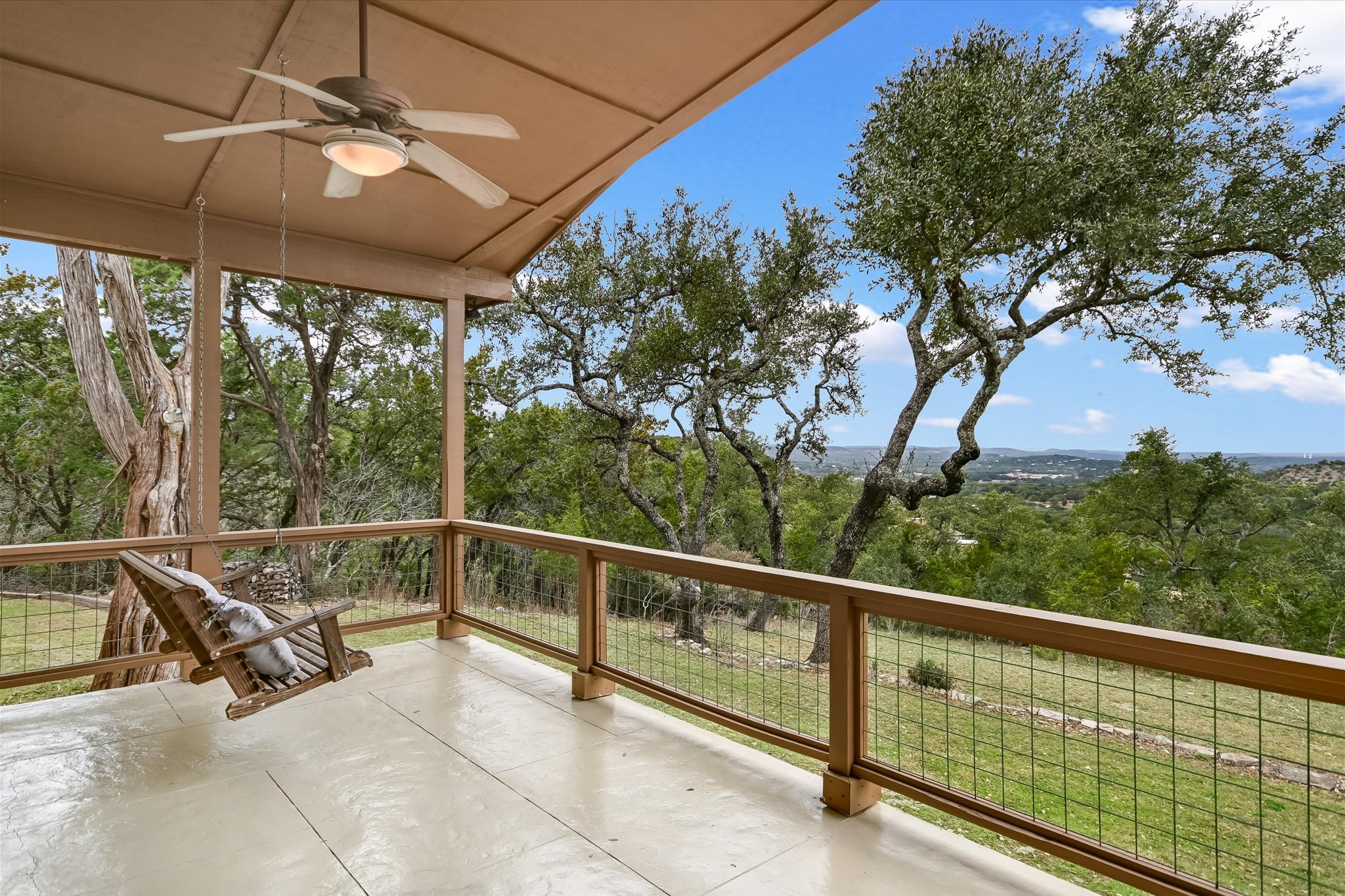 816 Buttercup Lane Wimberley, TX 78676 - Photo 1 of 36 a view of a two chairs and table in the balcony