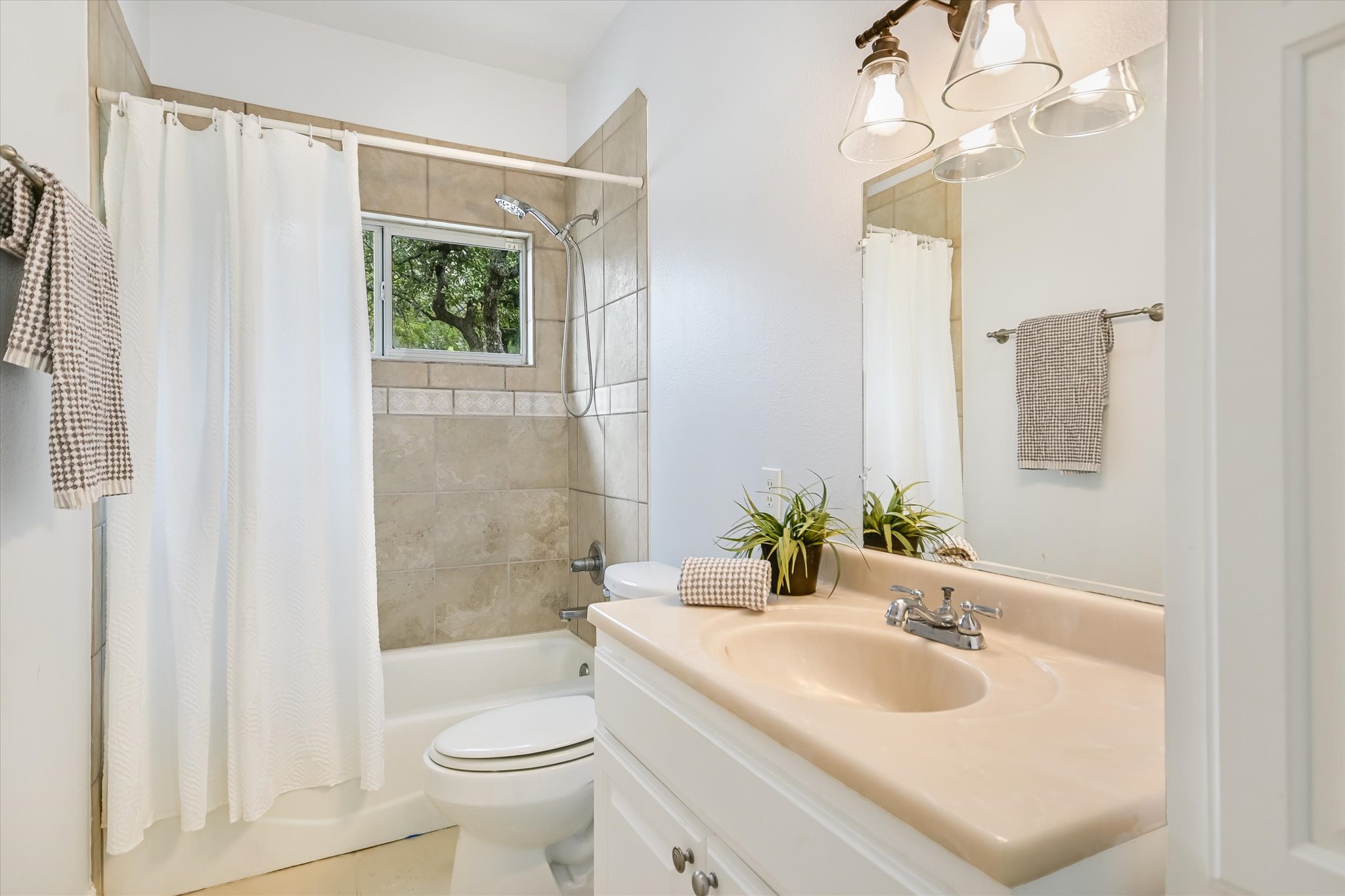 816 Buttercup Lane Wimberley, TX 78676 - Photo 23 of 36 a bathroom with a sink toilet tub and shower