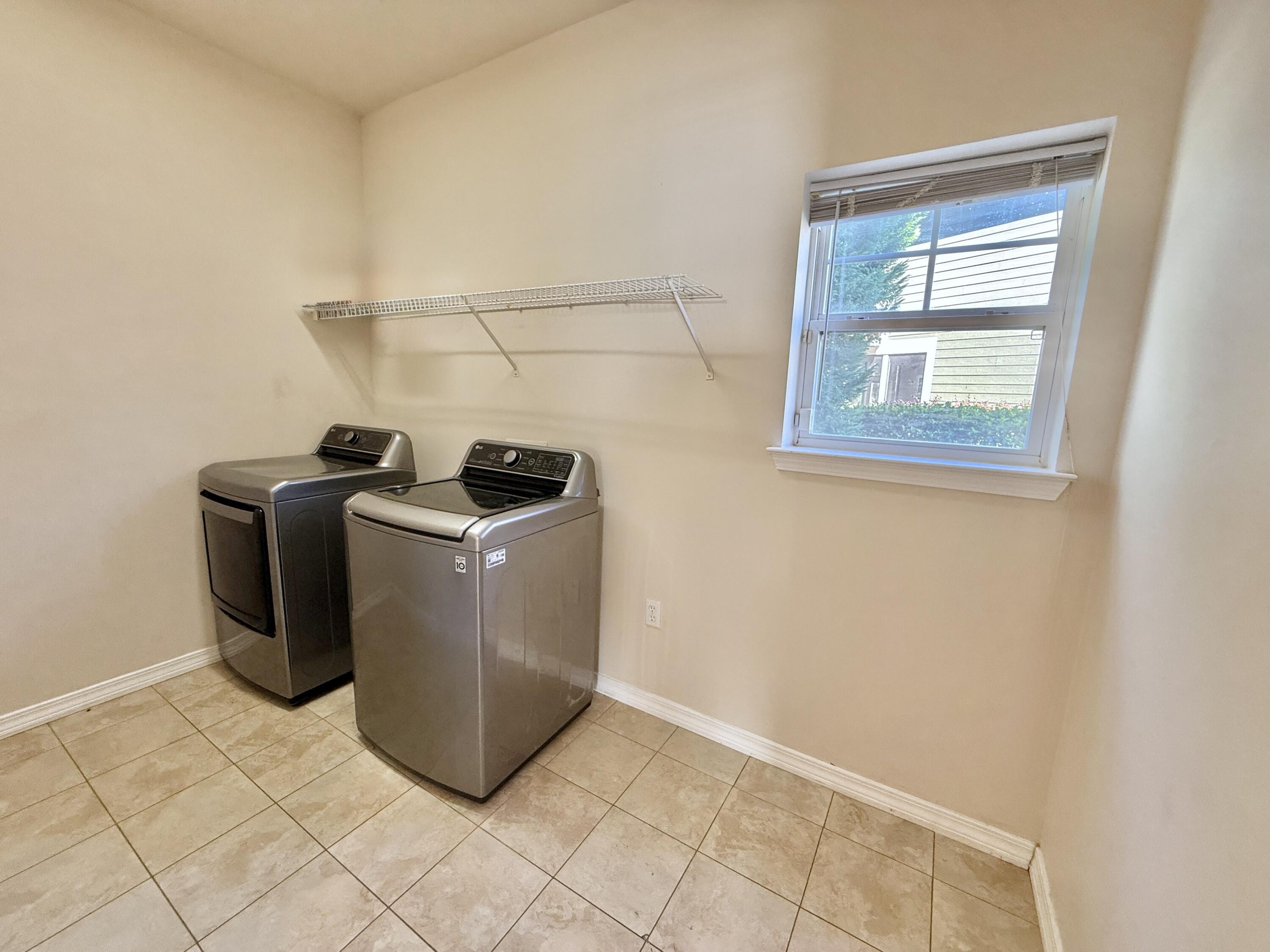 197 Hackberry Way Santa Rosa Beach, FL 32459 - Photo 11 of 26 a view of storage and utility room with washer and dryer