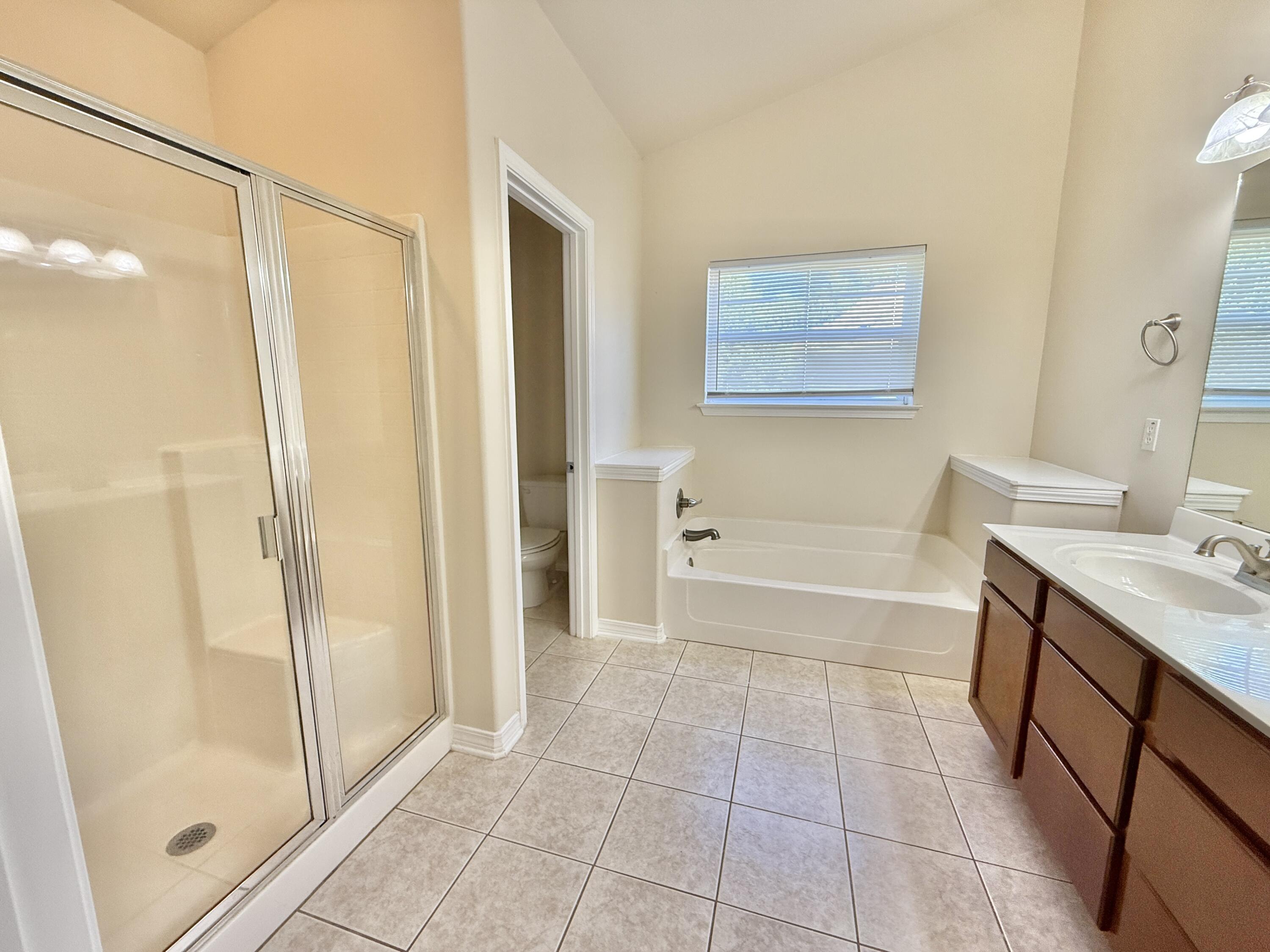 197 Hackberry Way Santa Rosa Beach, FL 32459 - Photo 15 of 26 a bathroom with a bathtub and a shower