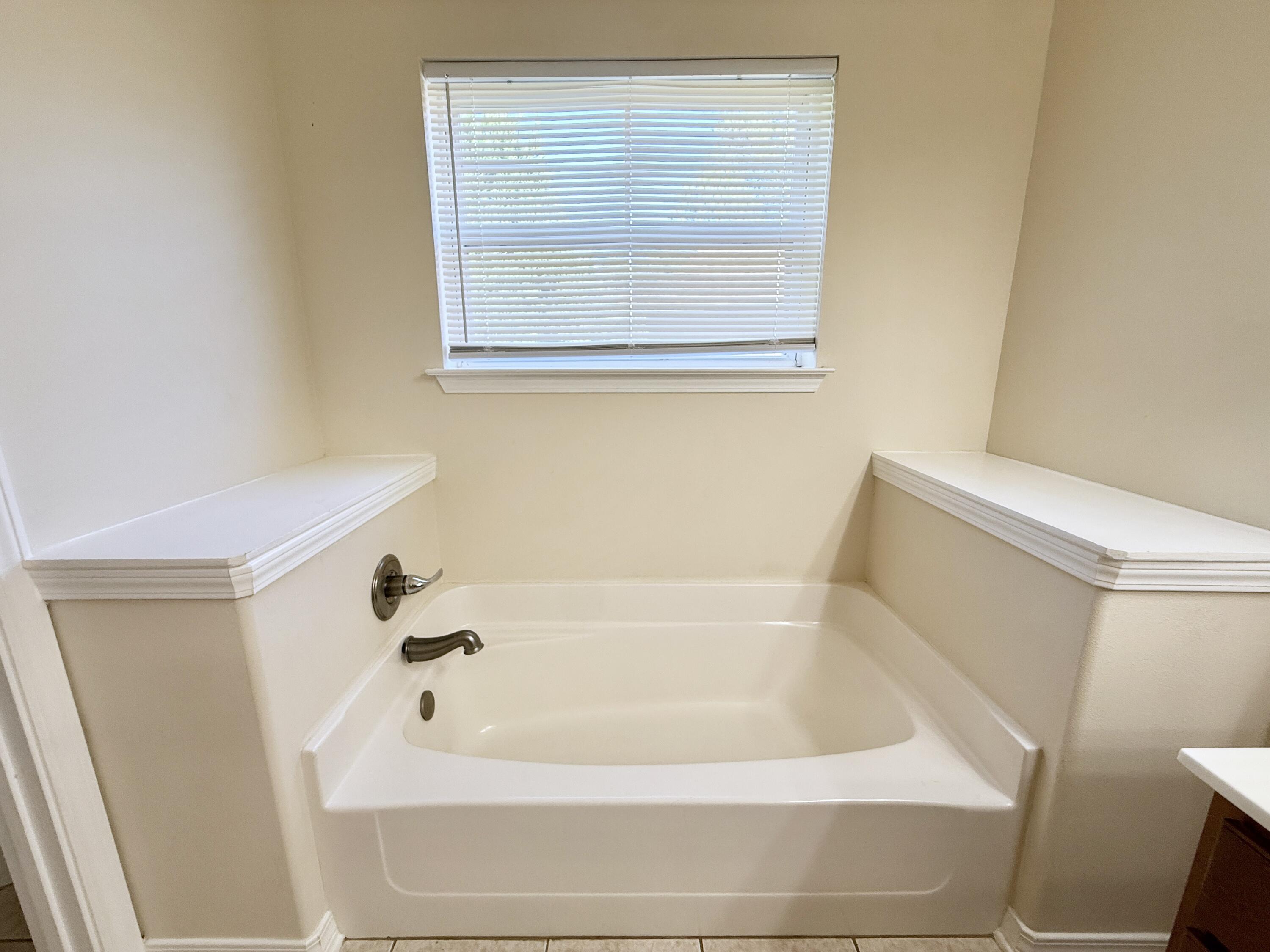 197 Hackberry Way Santa Rosa Beach, FL 32459 - Photo 17 of 26 a bathroom with a bathtub