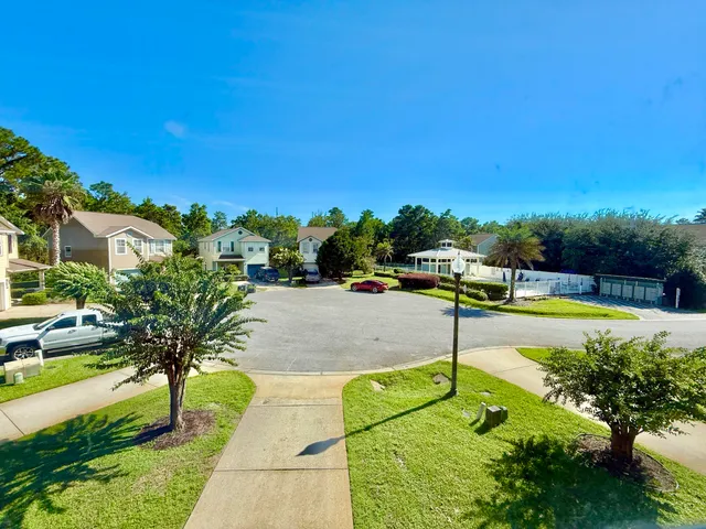 a view of a swimming pool with a yard