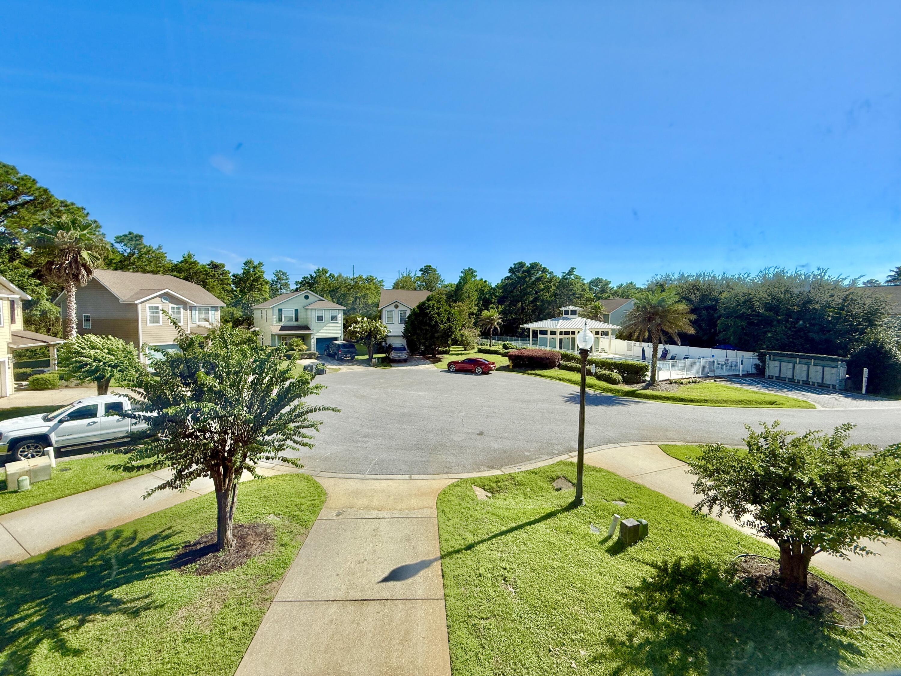 197 Hackberry Way Santa Rosa Beach, FL 32459 - Photo 2 of 26 a view of a swimming pool with a yard