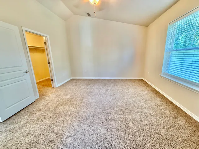 a view of a backyard of the house