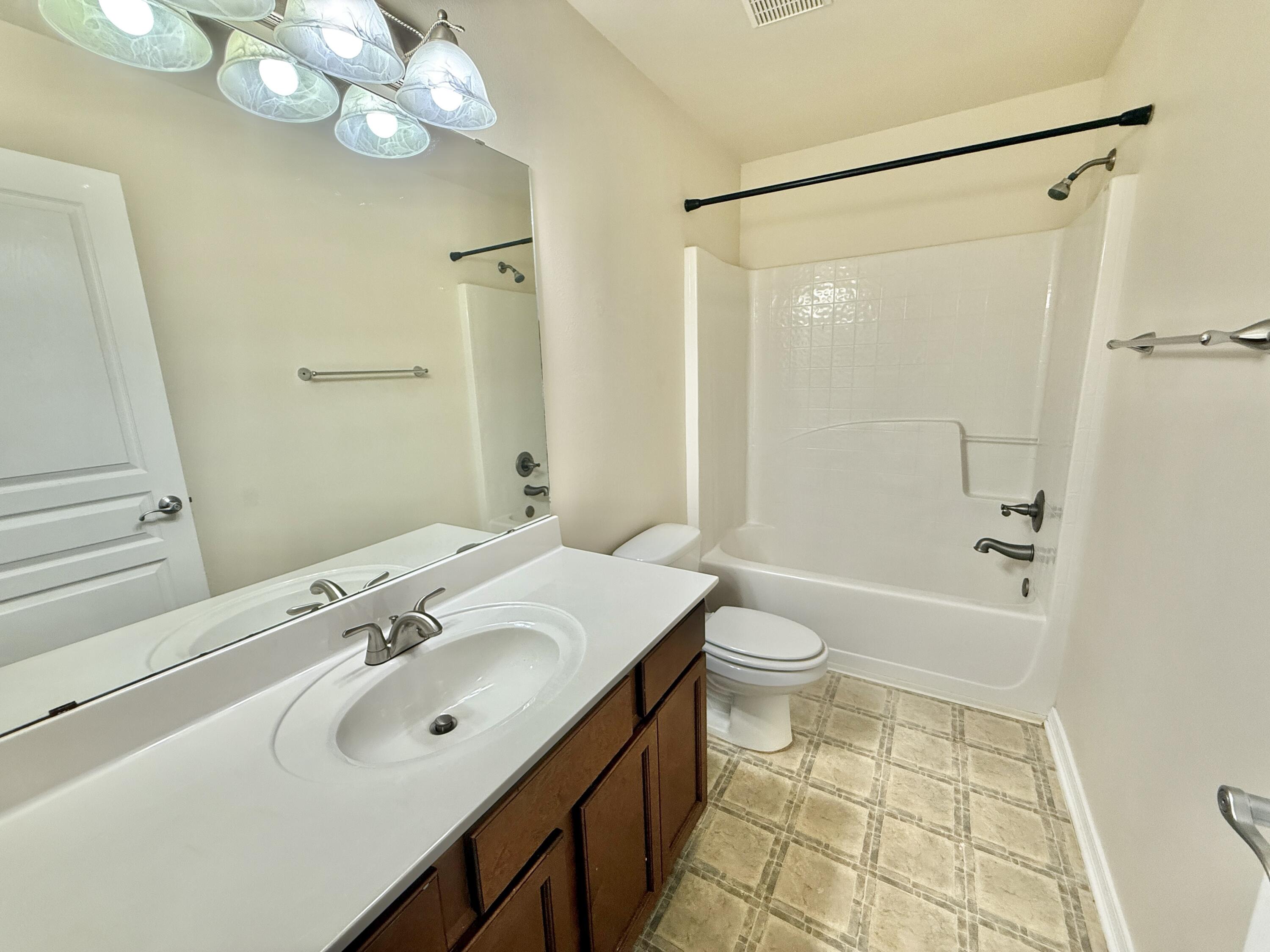 197 Hackberry Way Santa Rosa Beach, FL 32459 - Photo 23 of 26 a bathroom with a sink a toilet and shower