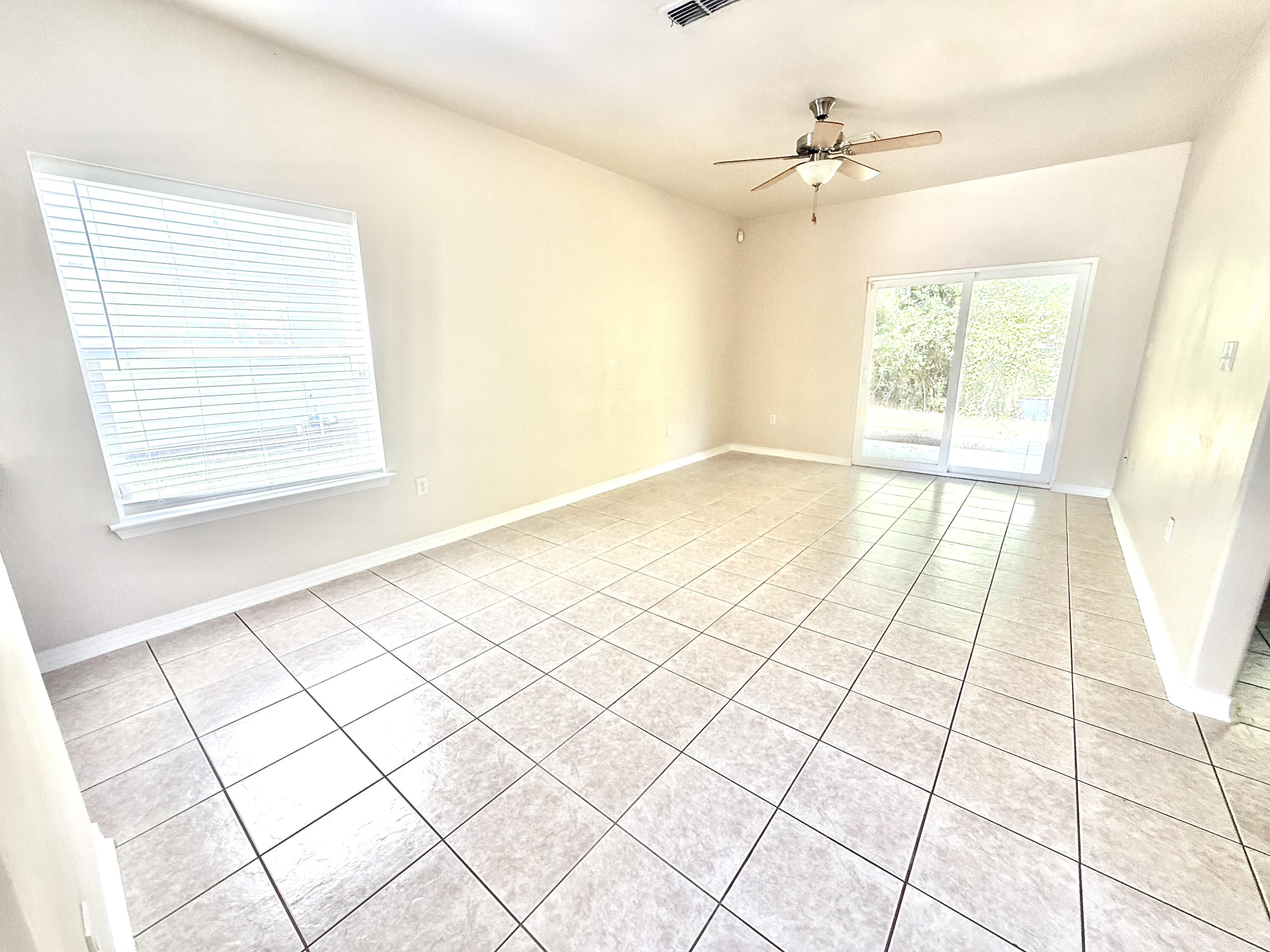 197 Hackberry Way Santa Rosa Beach, FL 32459 - Photo 3 of 26 a view of an empty room and window