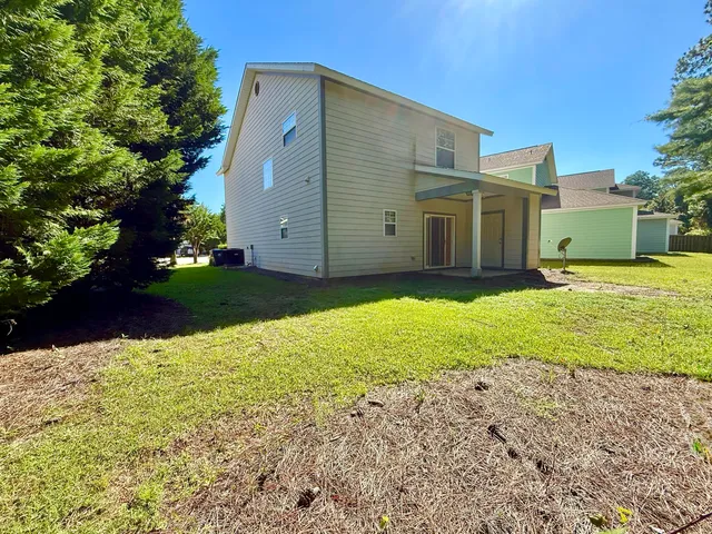 a view of a backyard of the house