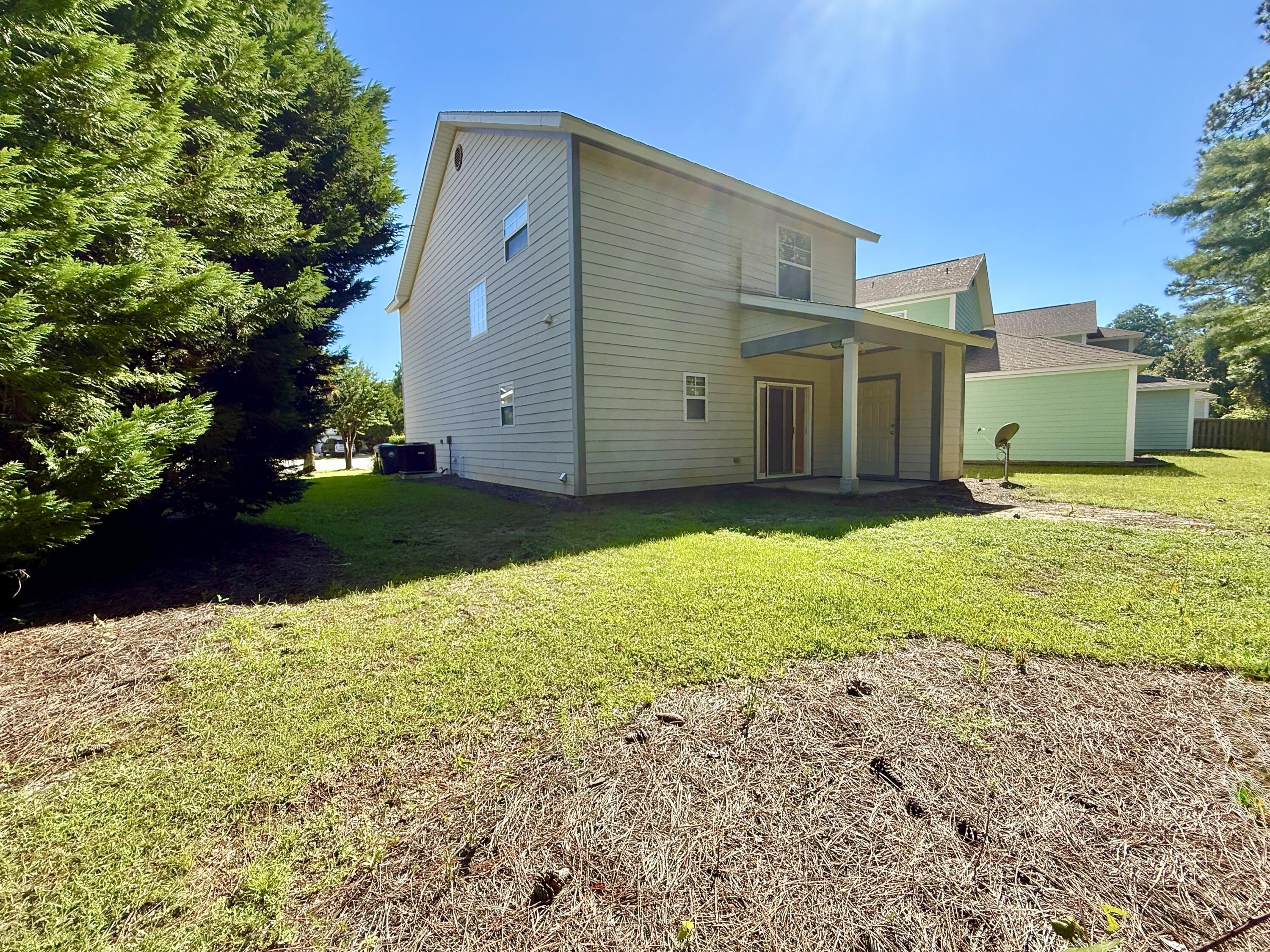 197 Hackberry Way Santa Rosa Beach, FL 32459 - Photo 7 of 26 a view of a backyard of the house