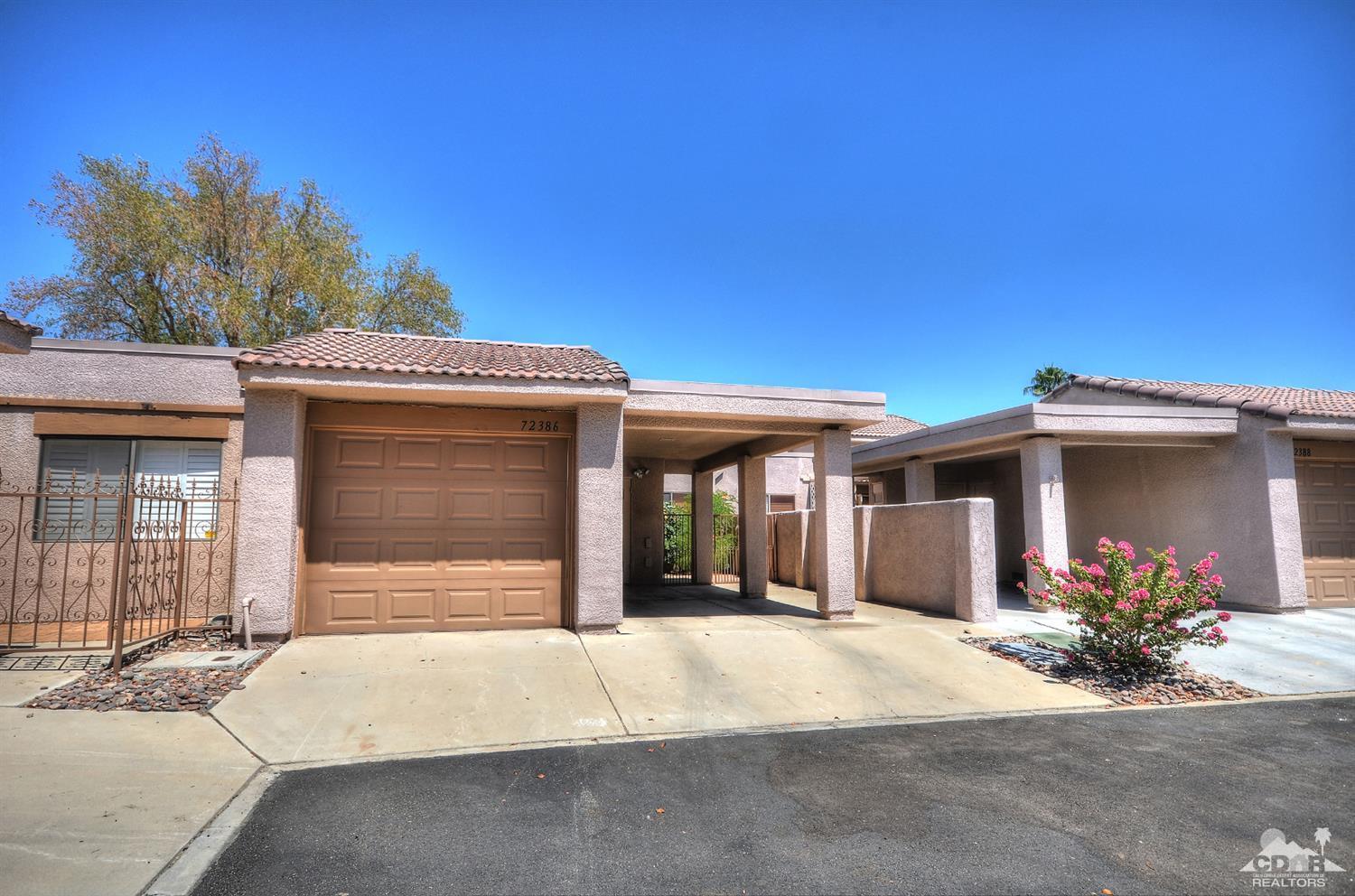 72386 Ridgecrest Lane Palm Desert, CA 92260 - Photo 1 of 38 a front view of a house with a garage