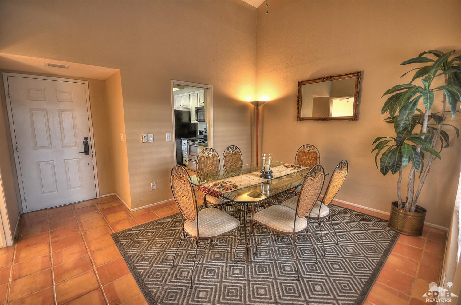 72386 Ridgecrest Lane Palm Desert, CA 92260 - Photo 11 of 38 a dining room with furniture and wooden floor