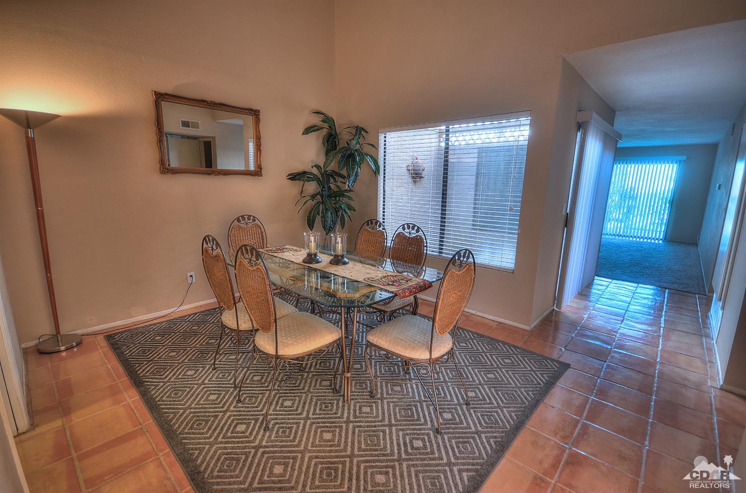 72386 Ridgecrest Lane Palm Desert, CA 92260 - Photo 12 of 38 a dining room with furniture and window
