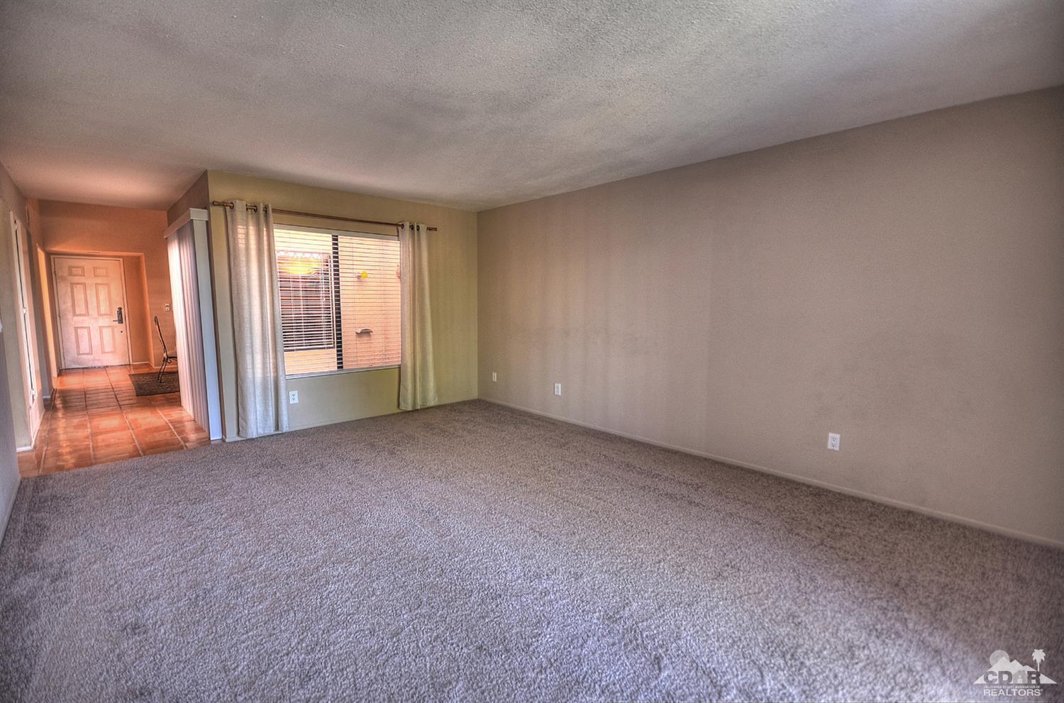 72386 Ridgecrest Lane Palm Desert, CA 92260 - Photo 14 of 38 a view of an empty room with a fireplace