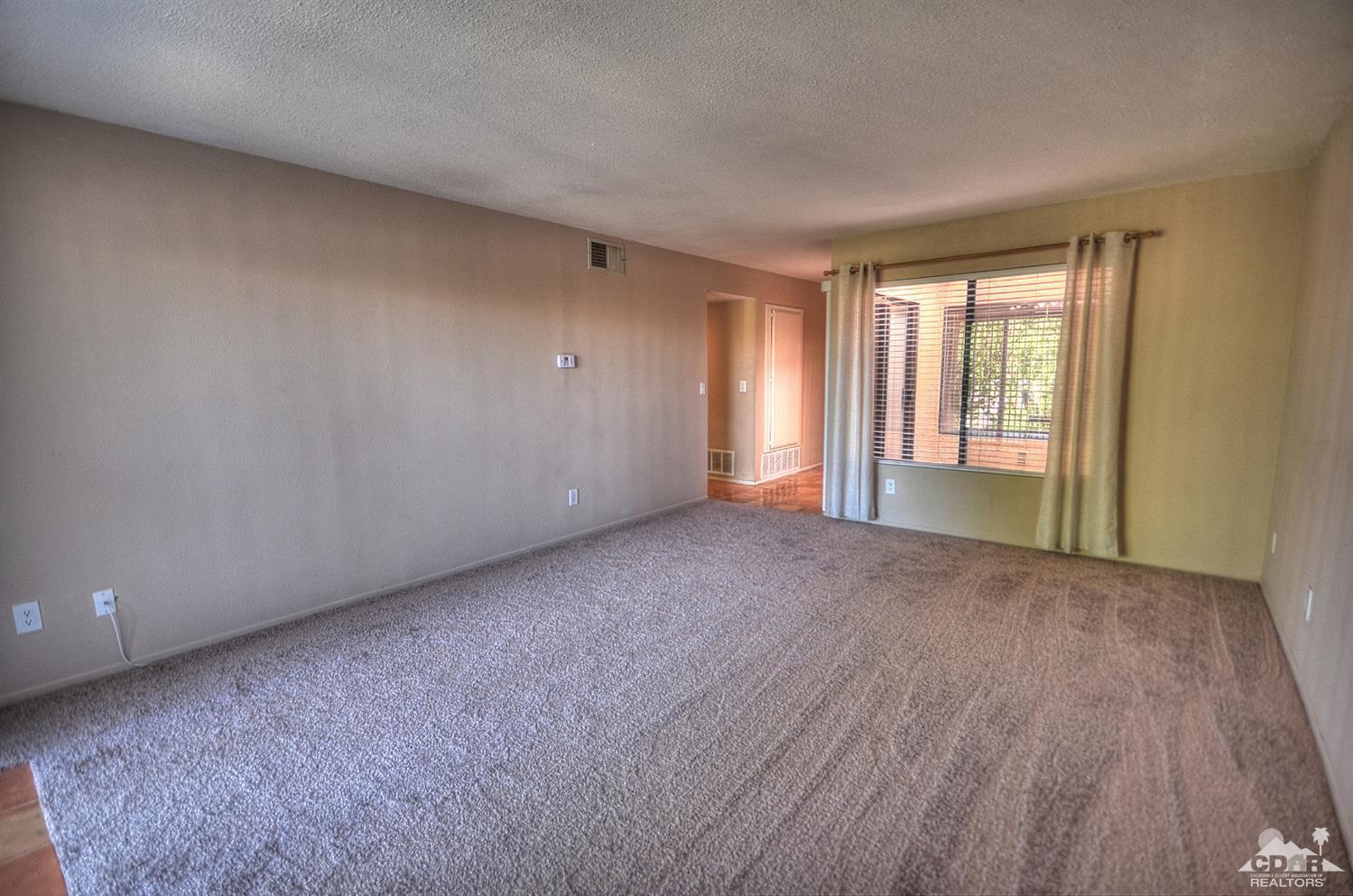 72386 Ridgecrest Lane Palm Desert, CA 92260 - Photo 15 of 38 a view of an empty room with a window