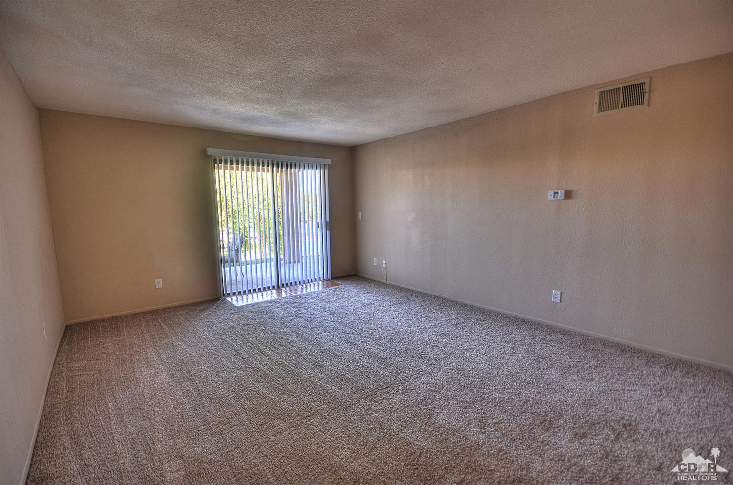 72386 Ridgecrest Lane Palm Desert, CA 92260 - Photo 16 of 38 a view of an empty room with a window