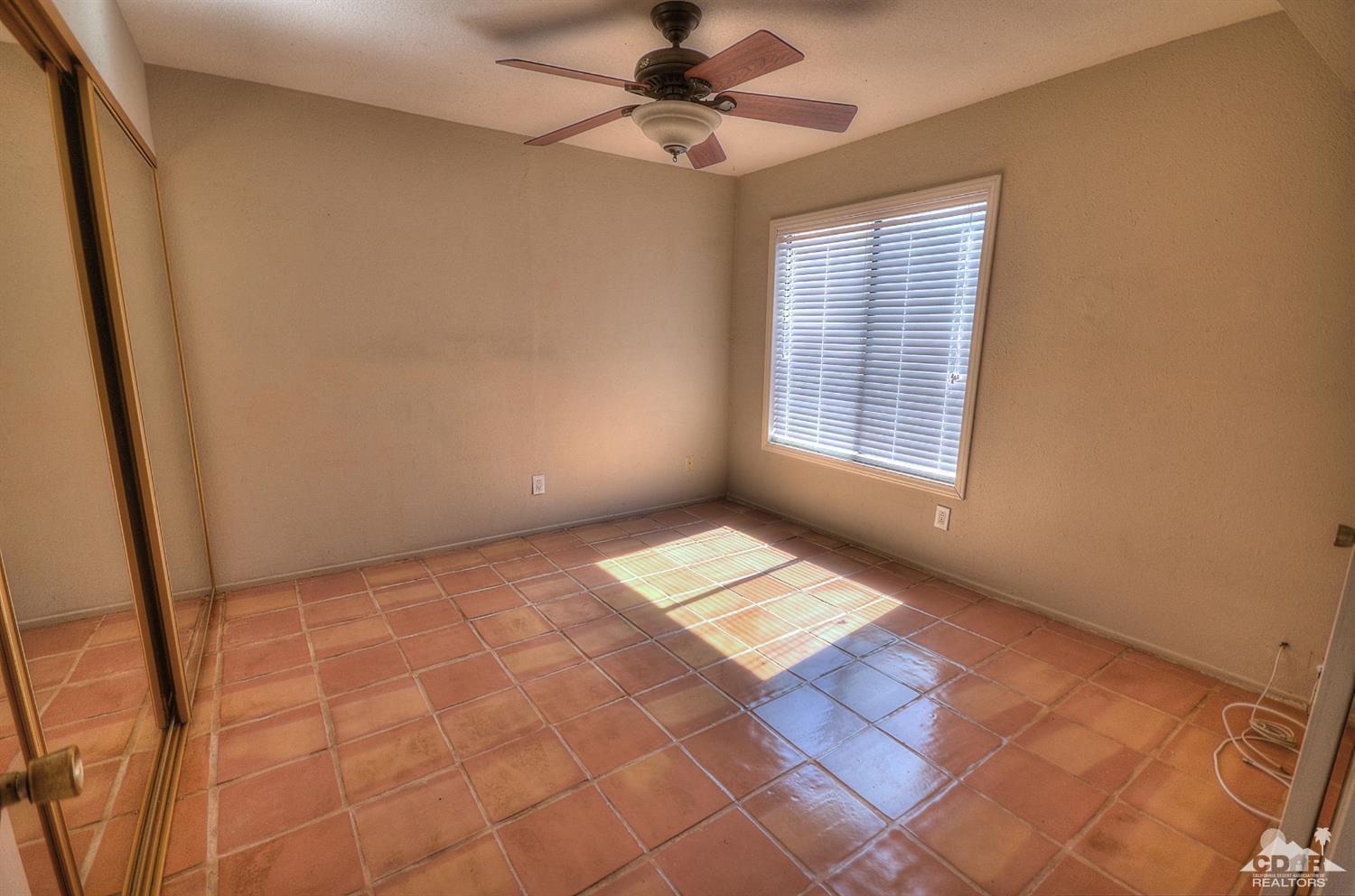 72386 Ridgecrest Lane Palm Desert, CA 92260 - Photo 17 of 38 a view of an empty room and window