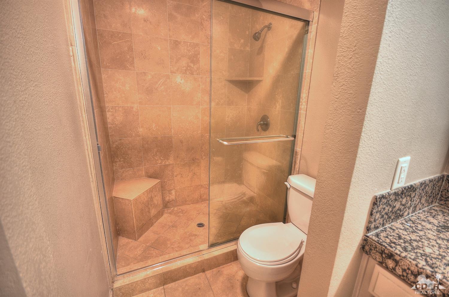 72386 Ridgecrest Lane Palm Desert, CA 92260 - Photo 24 of 38 a white toilet sitting next to a shower
