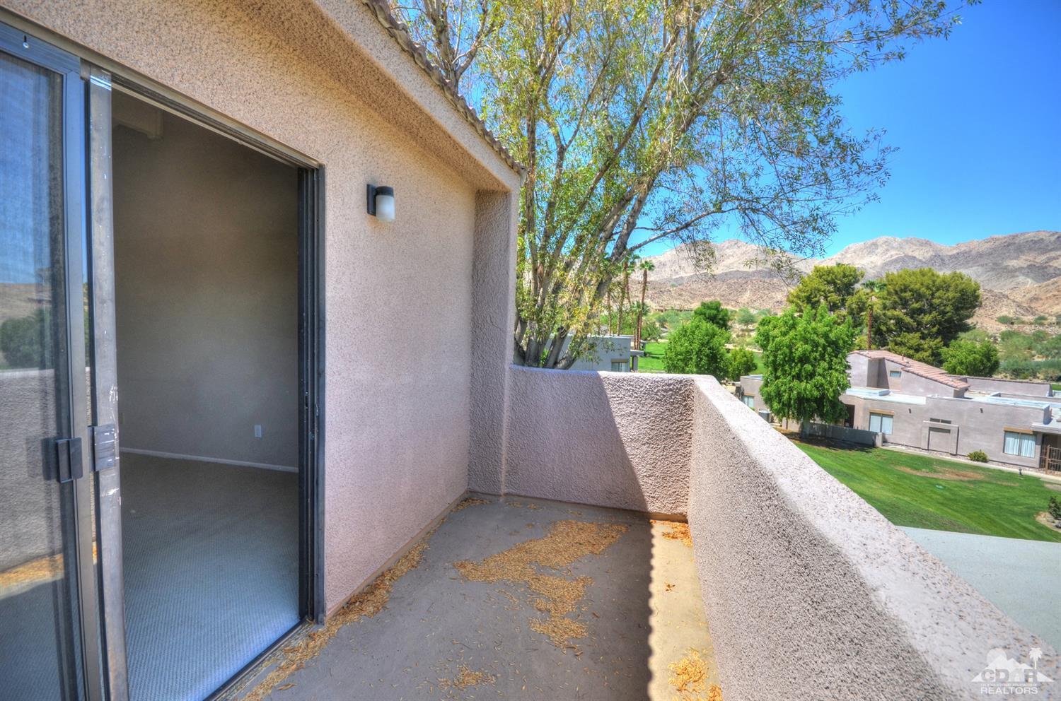 72386 Ridgecrest Lane Palm Desert, CA 92260 - Photo 31 of 38 a view of a patio in backyard