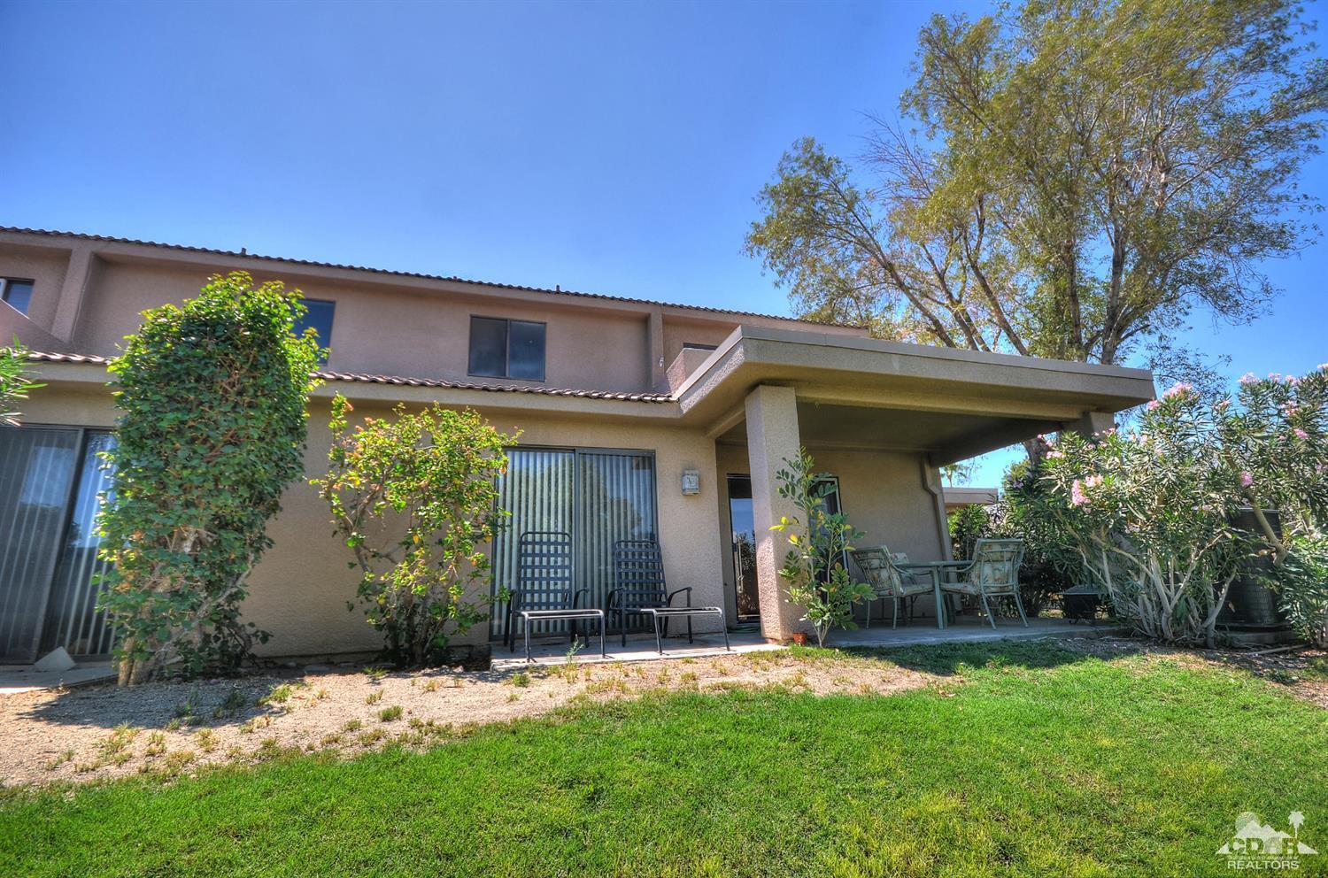 72386 Ridgecrest Lane Palm Desert, CA 92260 - Photo 33 of 38 a front view of a house with a yard