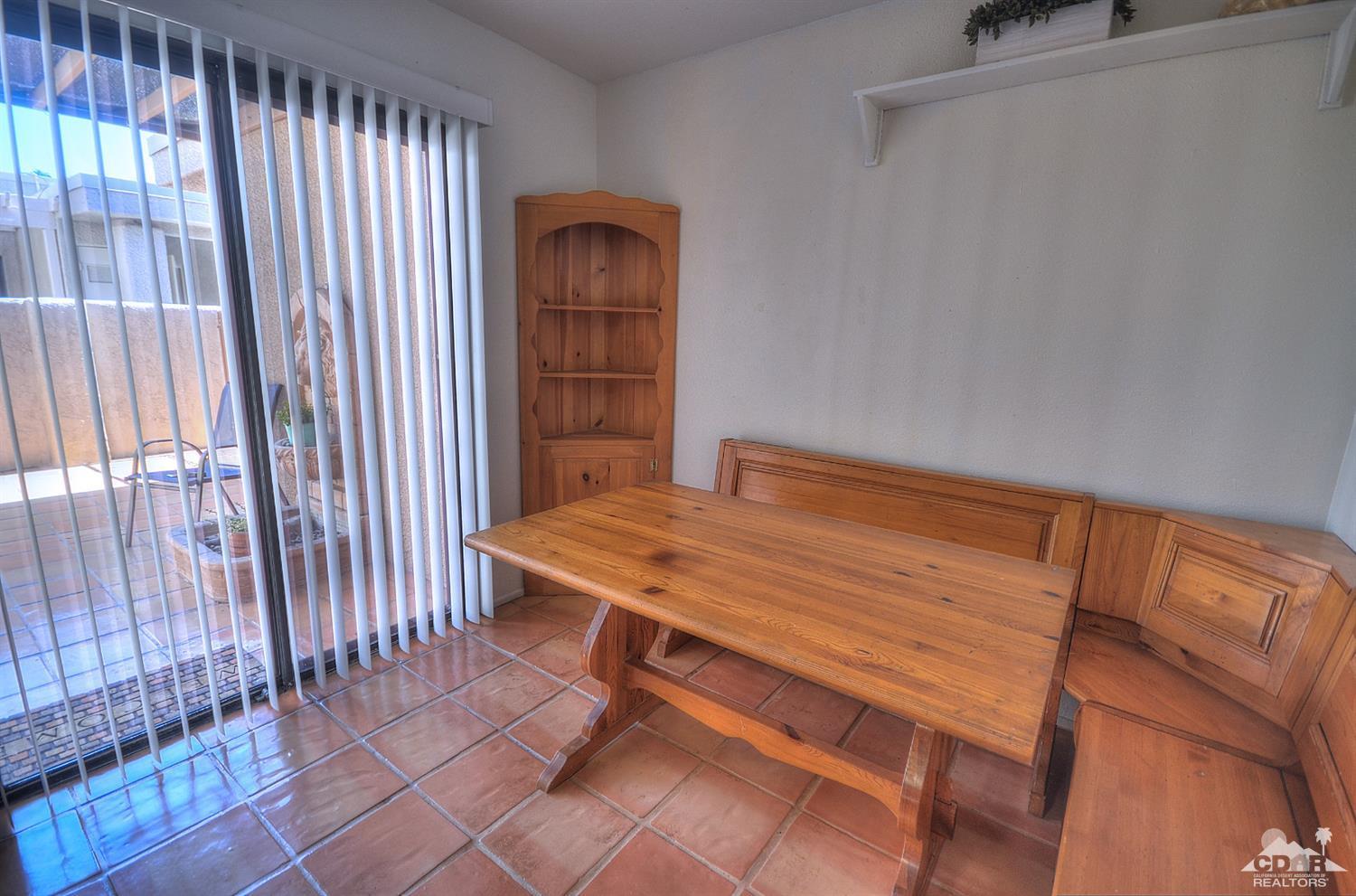 72386 Ridgecrest Lane Palm Desert, CA 92260 - Photo 10 of 38 a room with a table and a window