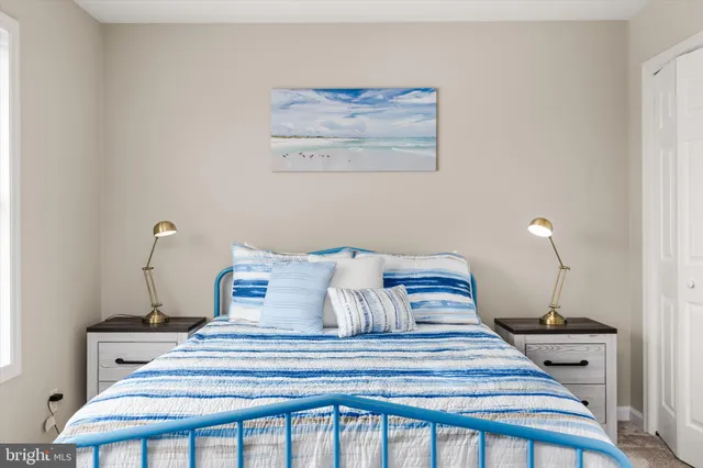 a bedroom with bed and a window