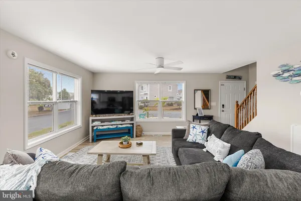 an aerial view of residential houses with outdoor space and swimming pool