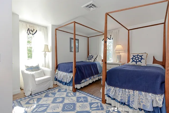 a bedroom with bed and a window