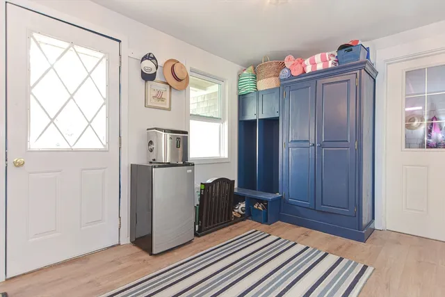a view of kitchen with furniture and wooden floor