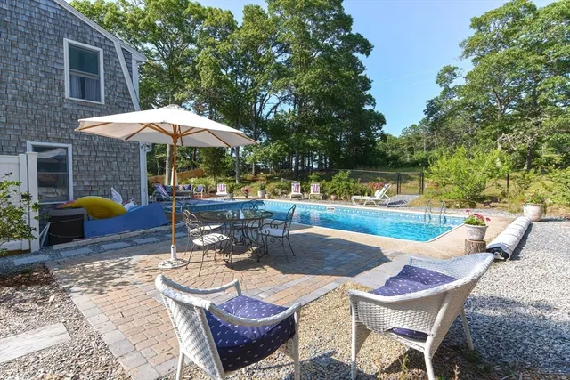 a view of a swimming pool with a patio
