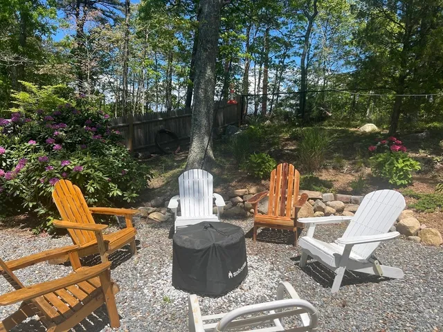 a view of a lake with couches and wooden floor