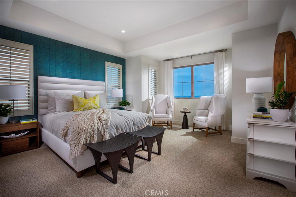 105 Thimbleberry, Unit 76 Irvine, CA 92618 - Photo 5 of 5 a spacious bedroom with a bed and a couch