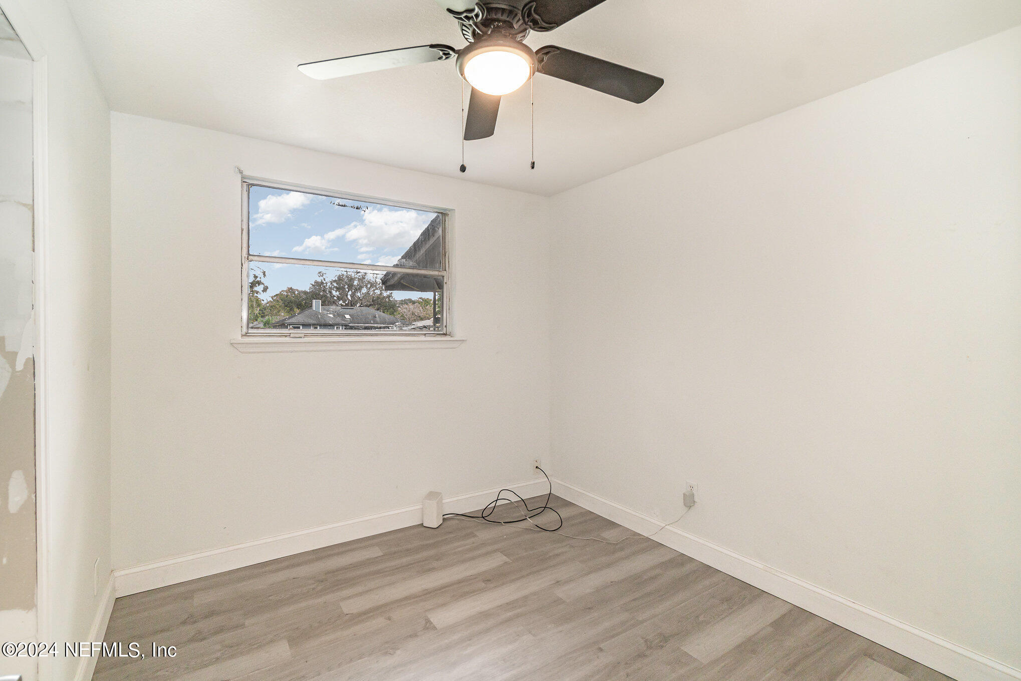 1108 Blair Road Jacksonville, FL 32221 - Photo 14 of 30 an empty room with a window and a fan