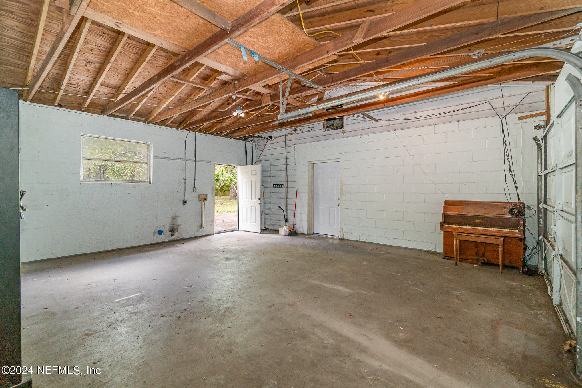 1108 Blair Road Jacksonville, FL 32221 - Photo 23 of 30 a view of a room with stairs and a couch