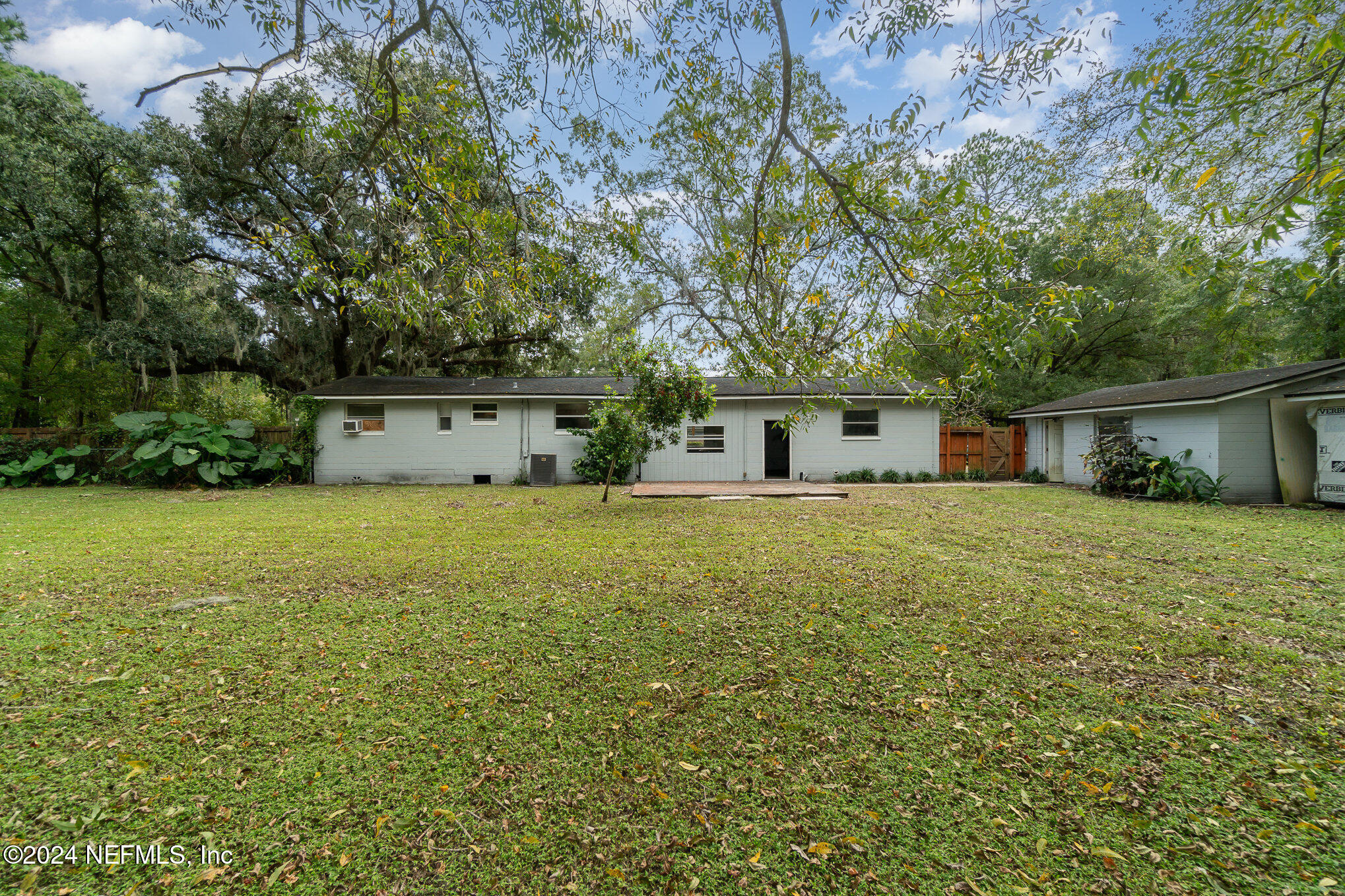 1108 Blair Road Jacksonville, FL 32221 - Photo 28 of 30 a front view of house with yard and trees