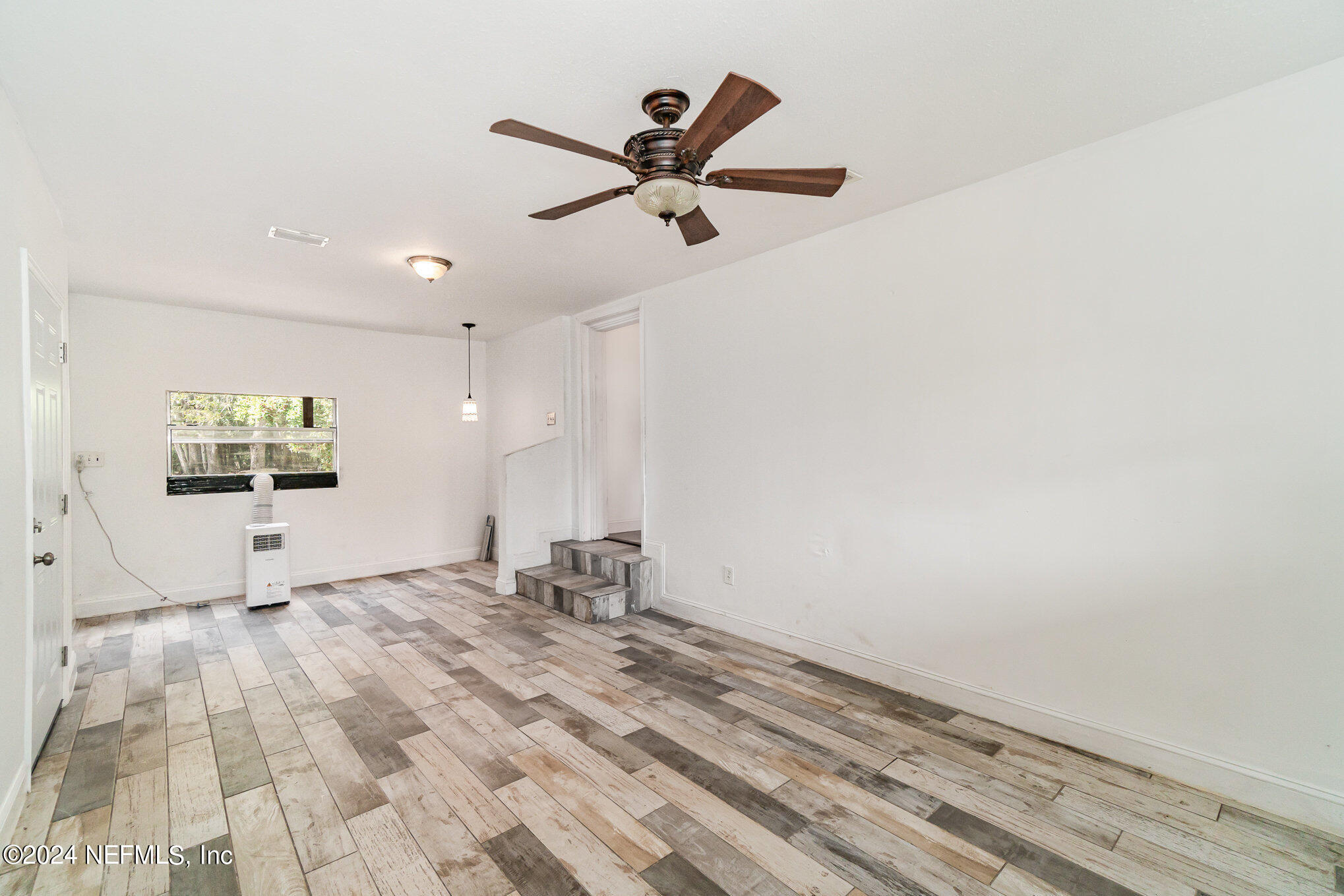 1108 Blair Road Jacksonville, FL 32221 - Photo 6 of 30 a view of empty room with wooden floor