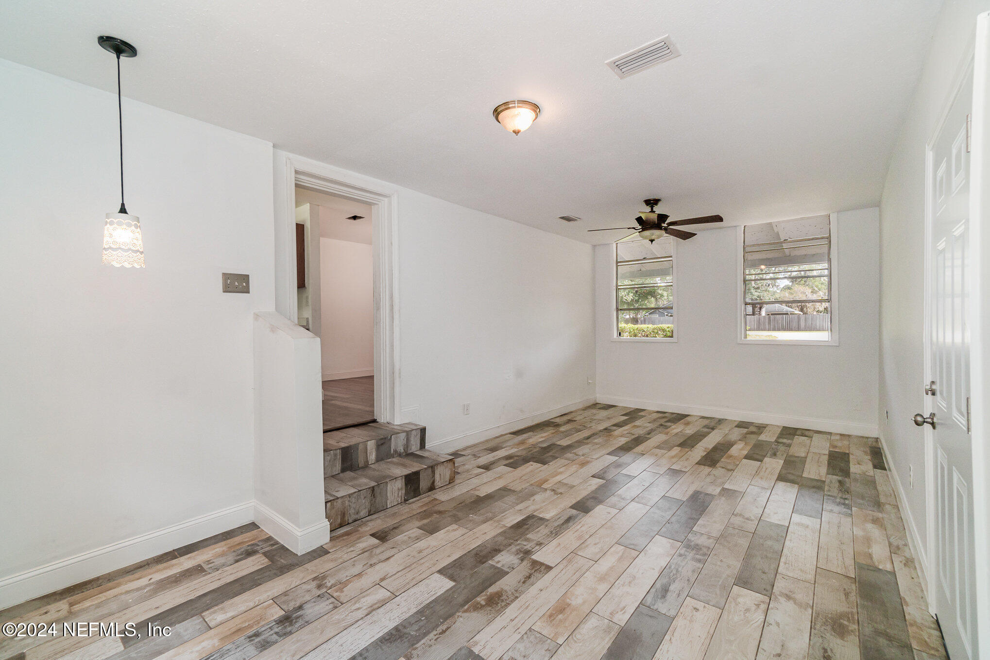 1108 Blair Road Jacksonville, FL 32221 - Photo 7 of 30 a view of empty room with wooden floor