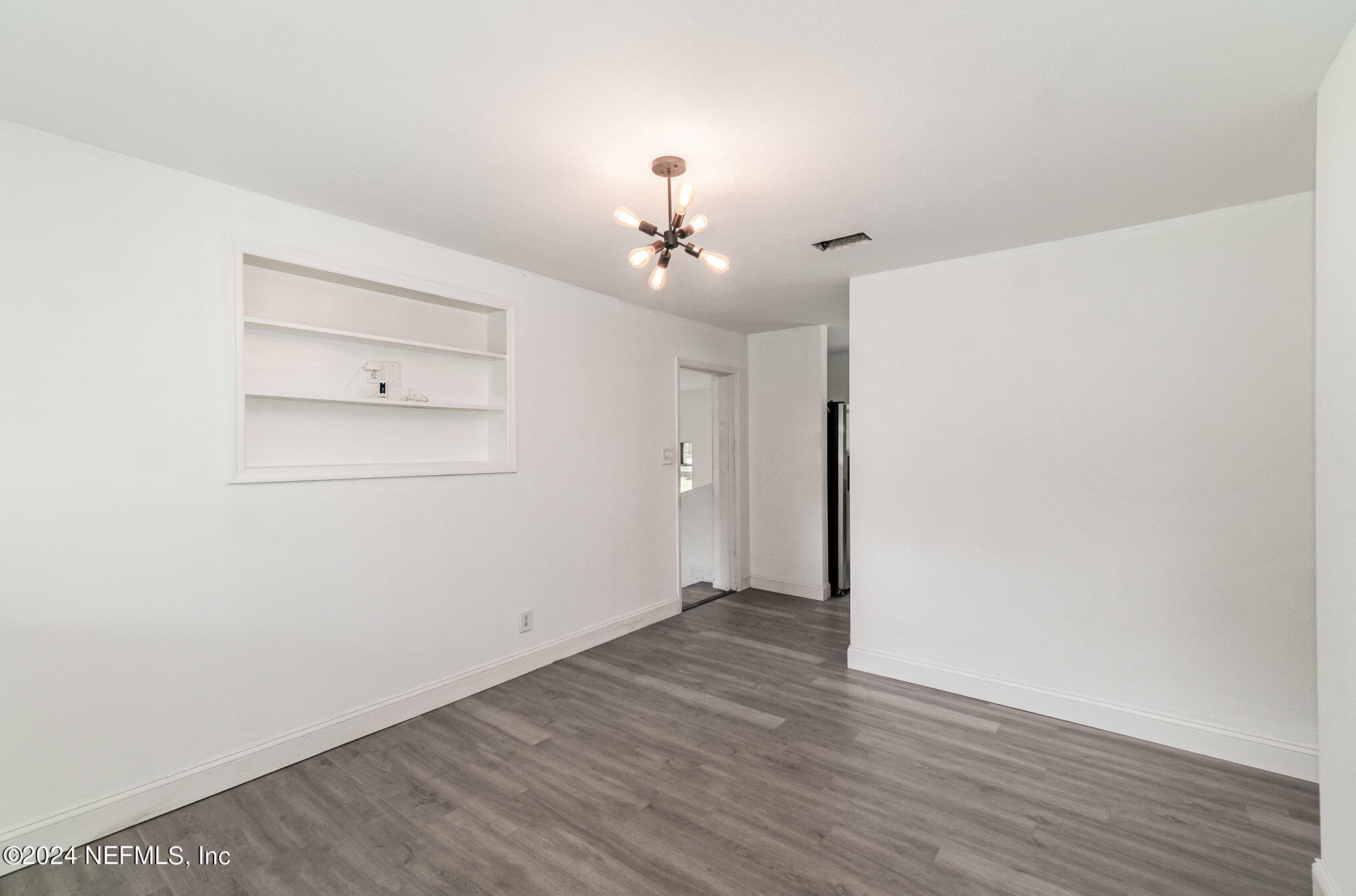 1108 Blair Road Jacksonville, FL 32221 - Photo 9 of 30 a view of a room with wooden floor