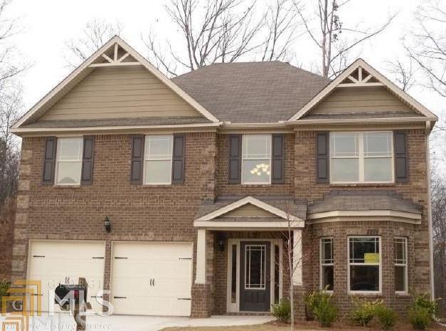 6205 Country Lake Road Cumming, GA 30041 - Photo 1 of 1 a front view of a house with a yard