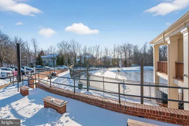 a view of a swimming pool with a patio and a yard