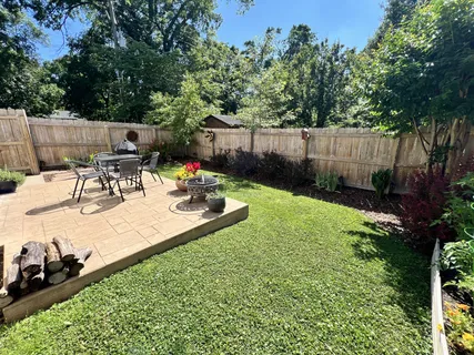a backyard of a house with lots of green space