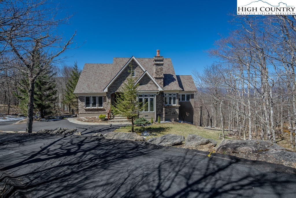 330 North Pinnacle Ridge Road Beech Mountain, NC 28604 - Photo 1 of 38 a view of a house with a yard