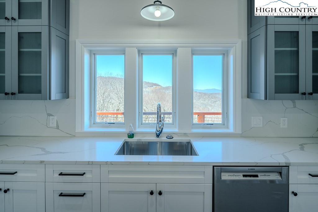 330 North Pinnacle Ridge Road Beech Mountain, NC 28604 - Photo 12 of 38 a kitchen with a sink and a window