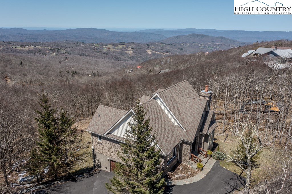 330 North Pinnacle Ridge Road Beech Mountain, NC 28604 - Photo 21 of 38 an aerial view of a house with a mountain