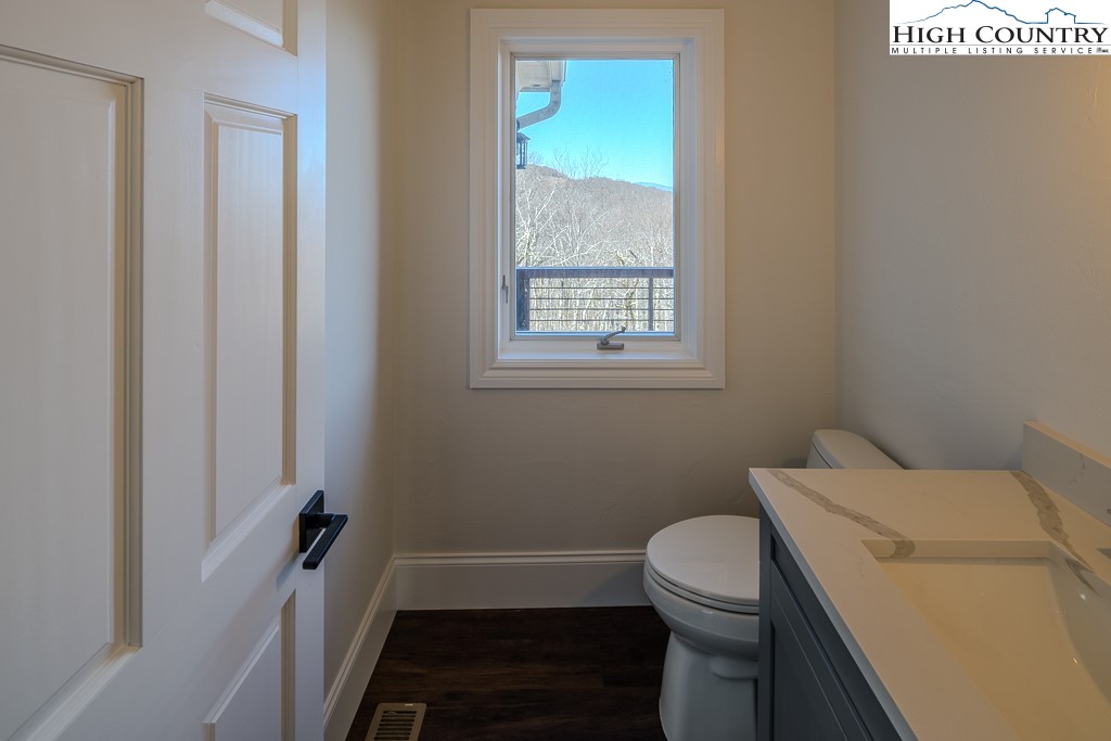 330 North Pinnacle Ridge Road Beech Mountain, NC 28604 - Photo 22 of 38 a bathroom with a sink and a toilet